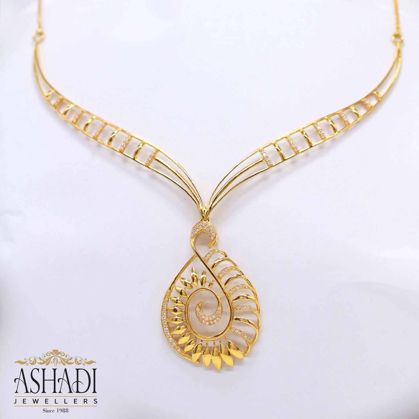 Ashadi Gold Spiral Leaf Necklace – Elegant Teardrop Pendant Design